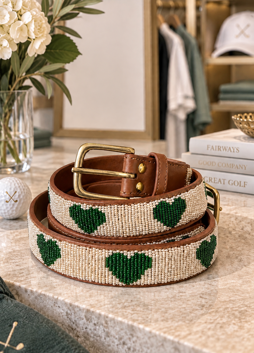 Ace of Hearts beaded golf belt for women with green beaded hearts on cream, tan leather and brass buckle