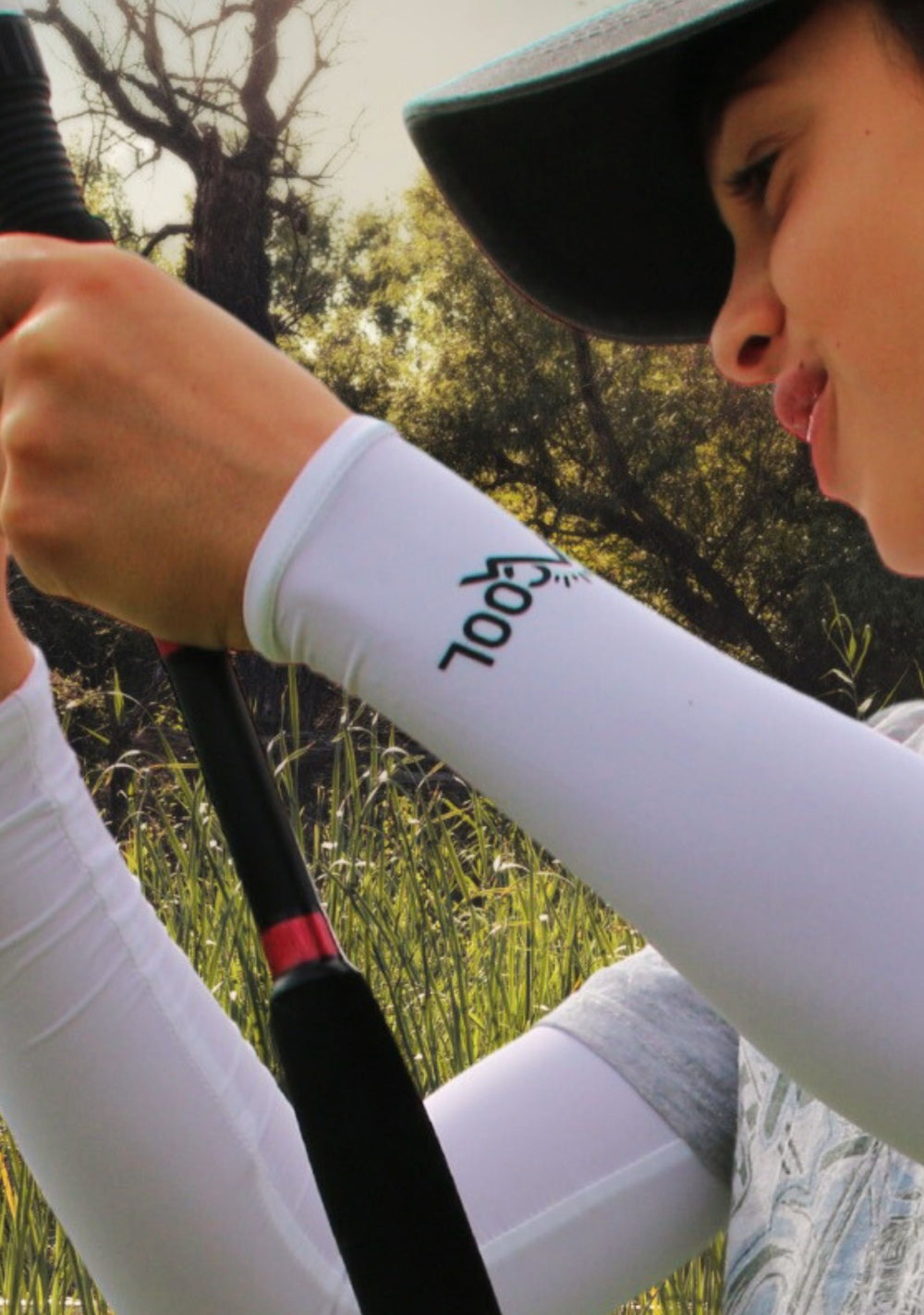 Child wearing Sta-Cool Junior UPF 50+ sun protection arm sleeves